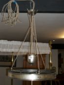 An Art Deco silver plated rise and fall ceiling light