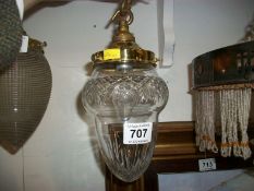 An Edwardian cut glass hall light with brass fittings