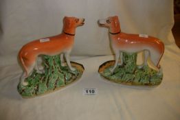 A pair of Staffordshire greyhounds