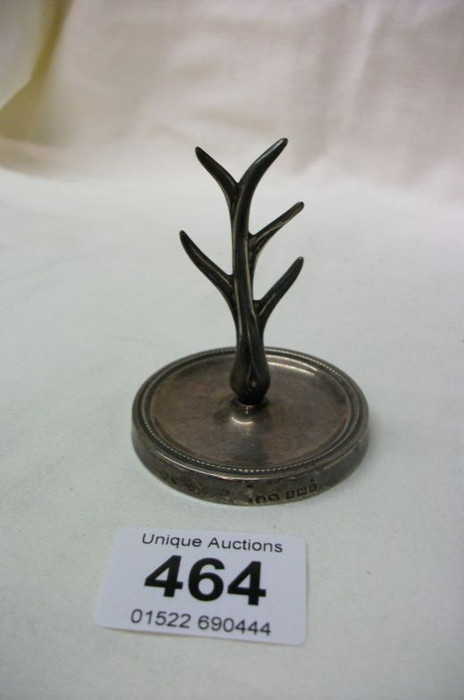 A silver ring tree