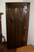 An oak corner wardrobe