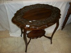 A Victorian occasional table with carved frieze on top