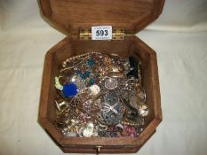 A wooden box with costume jewellery