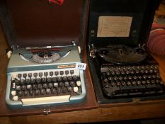 A Remington compact typewriter and one other