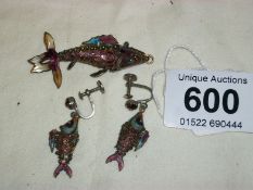 An early enamel articulated fish pendant and earrings