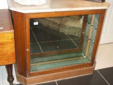 A marble top display cabinet with 6 drawers on either side