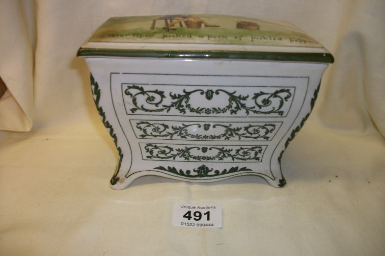 A Royal Doulton Huntley and Palmers biscuit barrel in the shape of a Commode chest