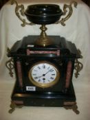 A Victorian black slate clock in working order