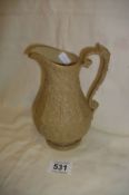 A Victorian stoneware jug with lozenge mark