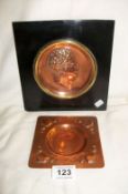 A brass and copper embossed wall plaque and a copper arts and crafts ashtray