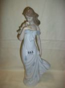 A tall Lladro figurine