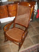 An Edwardian wicker rocking chair