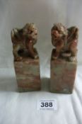 A pair of carved soapstone Dogs of Foo