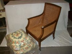 An old wicker arm chair with new cushions