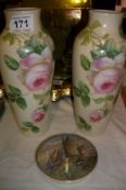 A pair of floral decorated vases and a Victorian pot lid