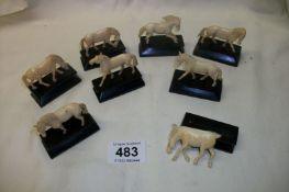 8 ivory horses on bases