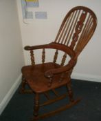 A Victorian hoop back rocking chair