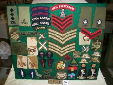 A collage of military cloth badges