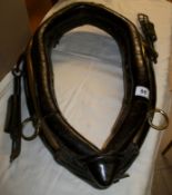 A large old cart horse collar