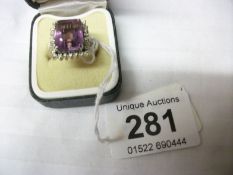 An 18ct gold amethyst and diamond ring