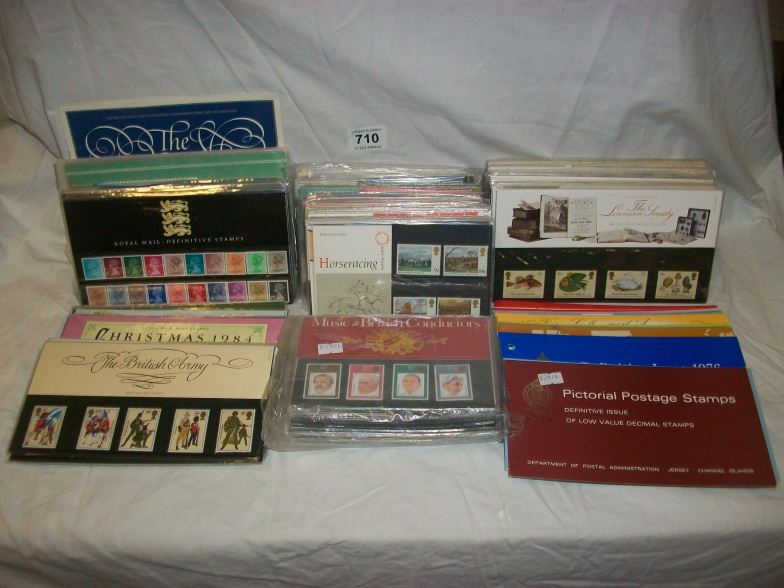 A collection of presentation packs and definitive sets of stamps