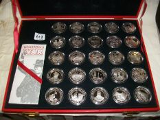 A cased set of 25 limited edition silver commemorative medalions commemorating 50th anniversary of