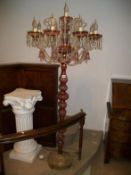 A pair of cranberry glass 8 arm standard chandelier lamps