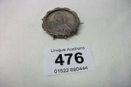 A Victorian silver coin brooch
