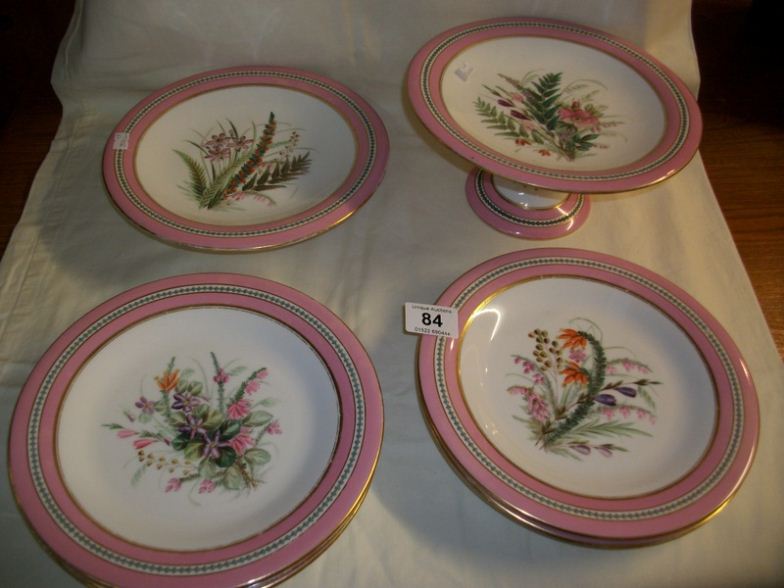 A Royal Worcester 8 piece hand painted dessert set comprising 2 comports and 6 plates