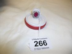 A Deco style 18ct gold ring set 1.5ct ruby and baguette cut diamonds
