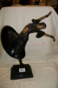 A bronze figure of a dancer