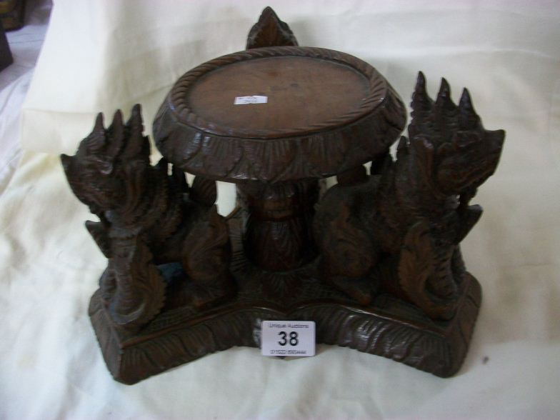 An early Asiatic carved wood stand