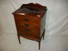 A mahogany 4 drawer music cabinet