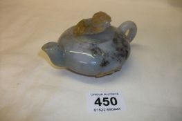 A jade teapot carved with bats