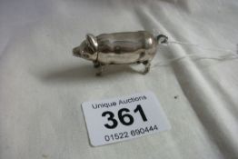 A silver pig vesta