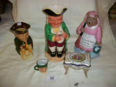 A Burlington Toby Jug, Wood's Toby jug, Miniature 2 faced Toby jug, Cast Iron bear doorstop and