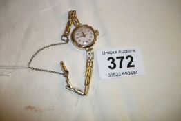 A gold 15 jewel ladies wrist watch