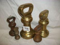 A set of 5 brass bell weights