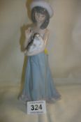 A Lladro figure of a boy with dog