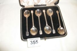 A set of 6 cased silver spoons