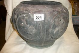 An early 19th century bronze pot, (missing bottom)