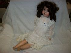 A German porcelain headed doll marked S & H
