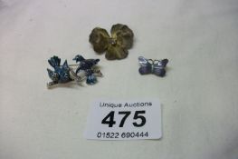 A bird brooch, pansy brooch and butterfly brooch