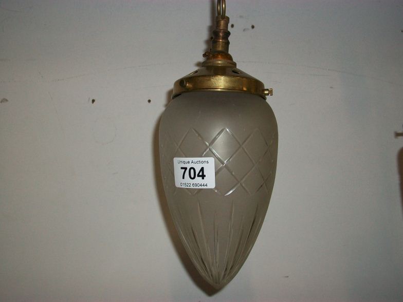 An Edwardian cut glass hall light with brass fittings