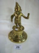 A Victorian brass bar top lighter in the shape of Mr Punch