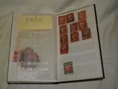 A small album of stamps including penny reds and George V