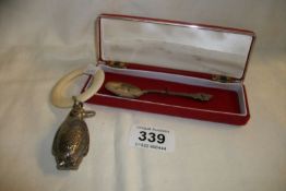 A silver Christening spoon 1983 and a silver plated penguin teething ring