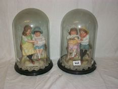 A pair of Victorian porcelain figures under glass dome