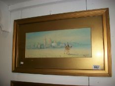 A framed and glazed watercolour, 'Arabian Desert Scene', signed H Salan