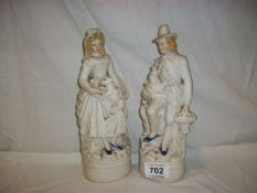 A pair of bisque figurines